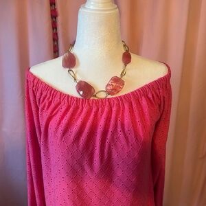Top Michael Kori’s cold shoulder coral colored